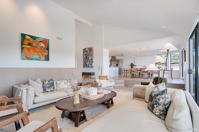living room featuring visible vents, high vaulted ceiling, and recessed lighting