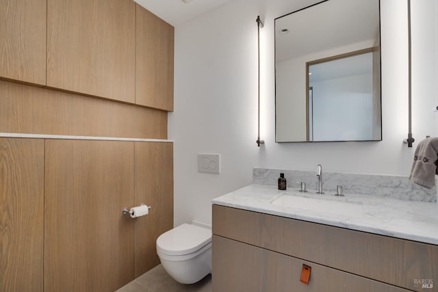 bathroom with toilet and vanity