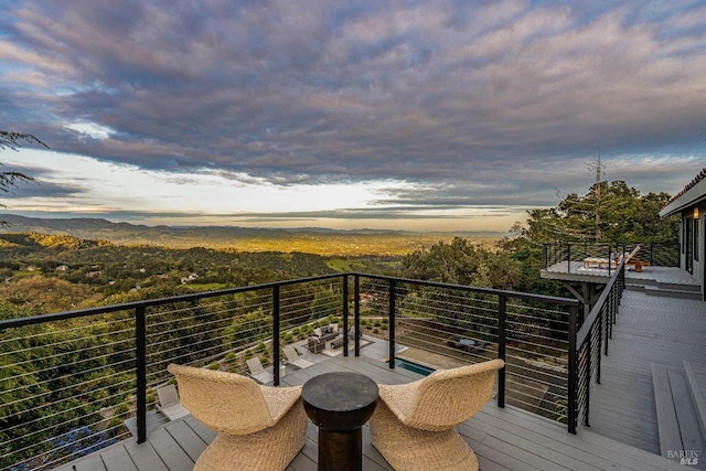 view of balcony at dusk
