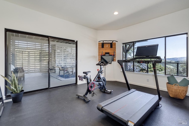 exercise area featuring recessed lighting and baseboards