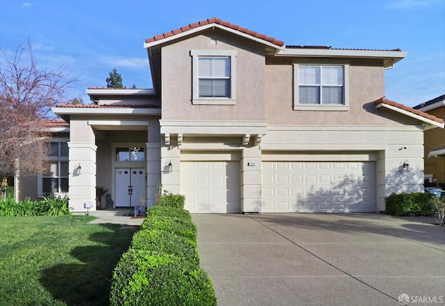 view of front facade with a front lawn and a garage