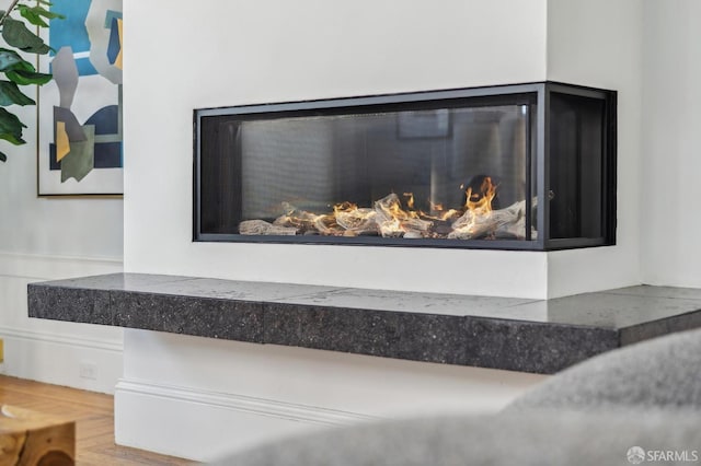 detailed view of a glass covered fireplace
