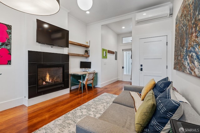 719-721 Shotwell St, San Francisco, CA 94110 - living area featuring a wall mounted AC, wood finished floors, a fireplace, baseboards, and ornamental molding