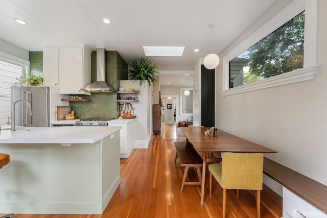 719-721 Shotwell St, San Francisco, CA 94110 - dining room featuring recessed lighting, light wood finished floors, and a skylight