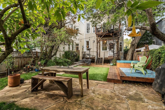 719-721 Shotwell St, San Francisco, CA 94110 - fenced backyard with a hot tub, a patio, a wooden deck, a balcony, and outdoor dining space