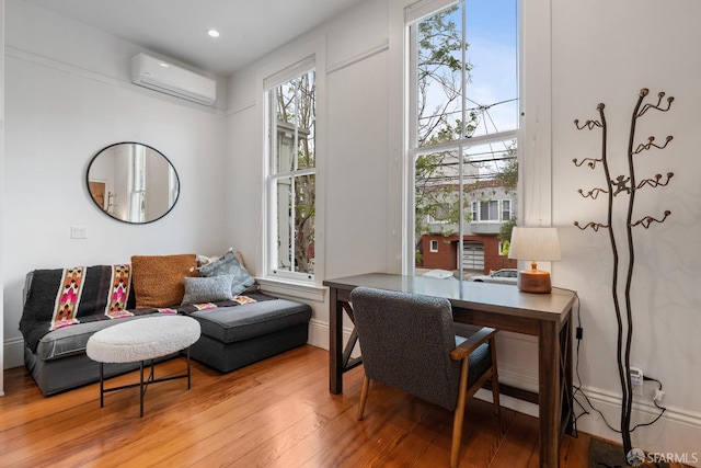 719-721 Shotwell St, San Francisco, CA 94110 - home office with an AC wall unit, light wood-style floors, and recessed lighting