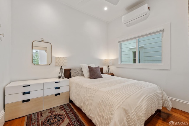 719-721 Shotwell St, San Francisco, CA 94110 - bedroom with a wall mounted air conditioner, wood finished floors, baseboards, and recessed lighting