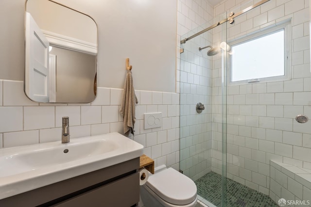 719-721 Shotwell St, San Francisco, CA 94110 - full bathroom featuring a shower stall, tile walls, vanity, toilet, and a wainscoted wall