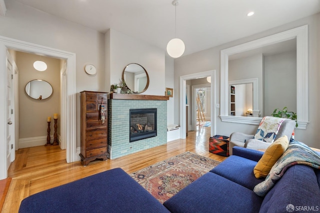 719-721 Shotwell St, San Francisco, CA 94110 - living room featuring a brick fireplace, wood finished floors, baseboards, and recessed lighting