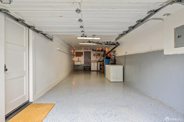 719-721 Shotwell St, San Francisco, CA 94110 - garage with washing machine and clothes dryer, electric panel, and a garage door opener