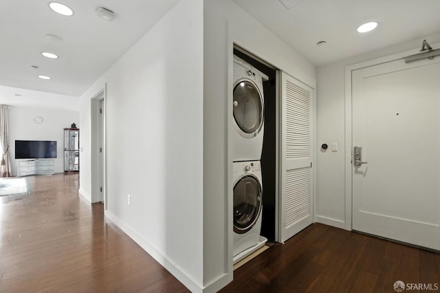 50 Jerrold Ave Unit 215, San Francisco, CA 94124 - laundry room featuring stacked washing machine and dryer, dark wood finished floors, and recessed lighting