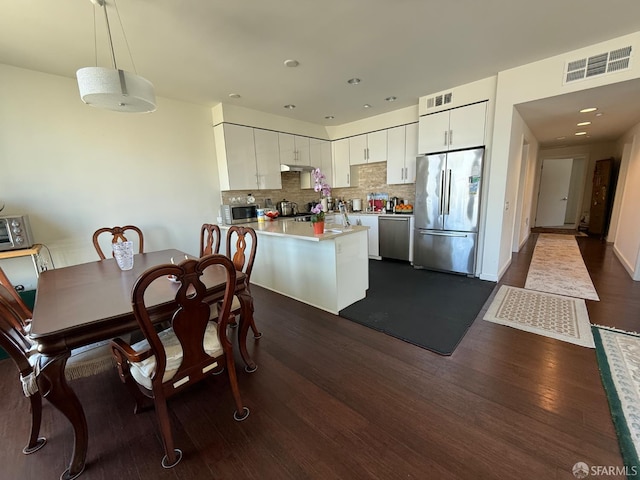 50 Jerrold Ave Unit 215, San Francisco, CA 94124 - dining area with dark wood-type flooring and recessed lighting