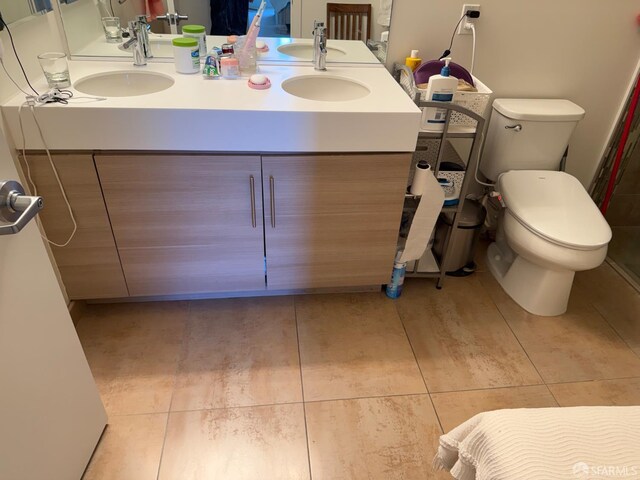 50 Jerrold Ave Unit 215, San Francisco, CA 94124 - bathroom with double vanity, tile patterned floors, and toilet