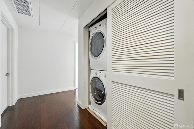 50 Jerrold Ave Unit 215, San Francisco, CA 94124 - laundry area with stacked washer and clothes dryer, attic access, and dark wood-type flooring