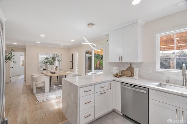 kitchen with dishwasher, a peninsula, white cabinetry, open shelves, and a sink