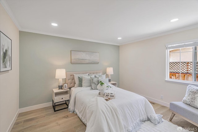 bedroom with ornamental molding, recessed lighting, light wood-style flooring, and baseboards