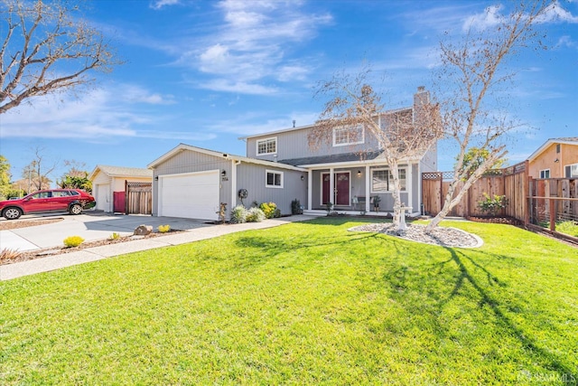 traditional-style house with a chimney, an attached garage, a front yard, fence, and driveway