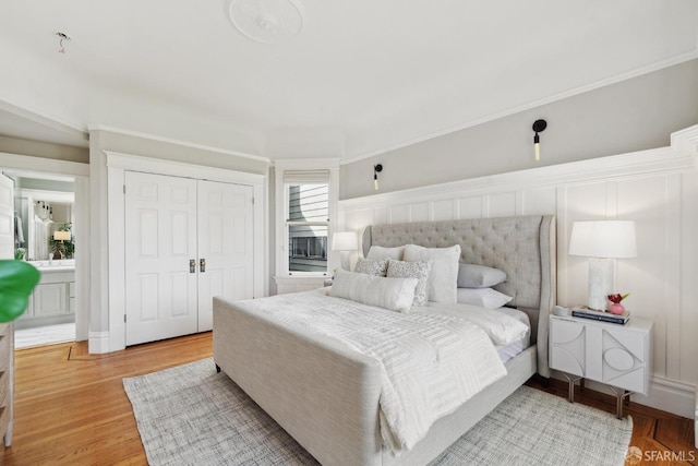 bedroom with a closet and wood finished floors