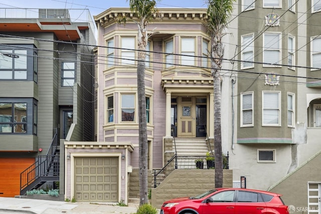 multi unit property with a garage and stairway