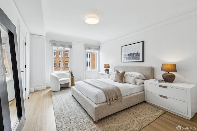 2100 Green St Unit 302, San Francisco, CA 94123 - bedroom with ornamental molding and light wood finished floors