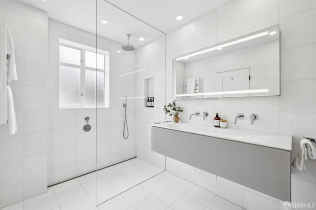 2100 Green St Unit 302, San Francisco, CA 94123 - full bathroom with tile patterned flooring, tile walls, a walk in shower, and vanity