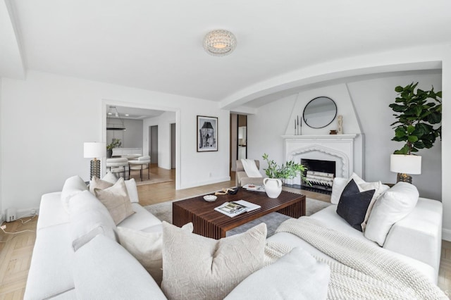 2100 Green St Unit 302, San Francisco, CA 94123 - living area with baseboards, arched walkways, and a premium fireplace