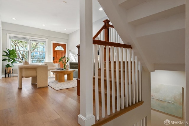 stairway featuring recessed lighting and wood finished floors