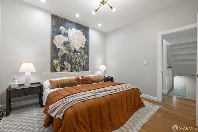 bedroom featuring recessed lighting, baseboards, and wood finished floors