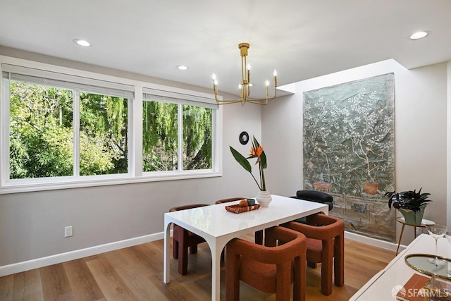 dining area featuring recessed lighting, baseboards, a healthy amount of sunlight, and wood finished floors