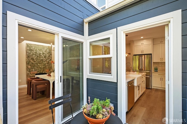 entrance to property with a sink