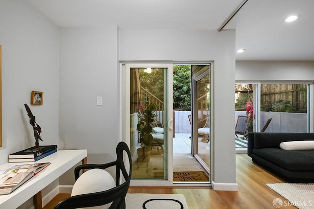 office area featuring recessed lighting, light wood-style floors, and baseboards