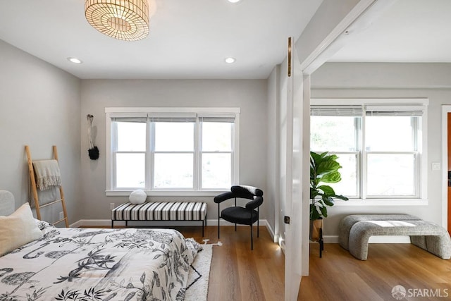 bedroom with recessed lighting, baseboards, and wood finished floors