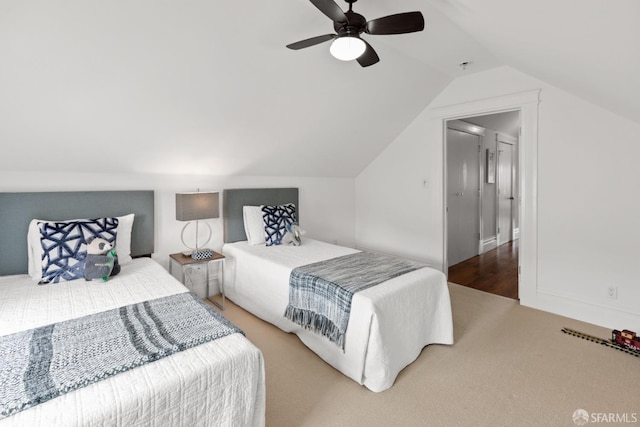 bedroom featuring ceiling fan, carpet flooring, and vaulted ceiling