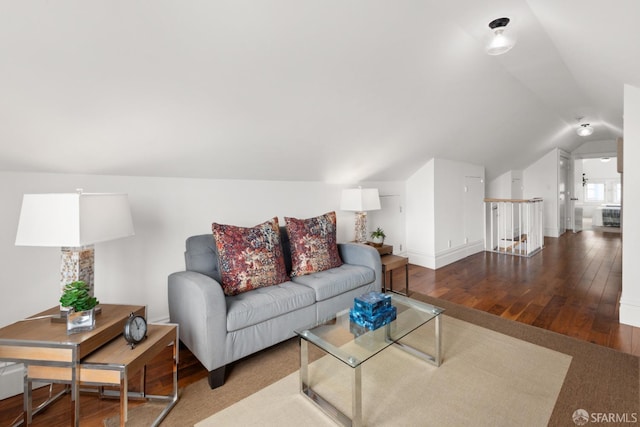 living room with hardwood / wood-style floors and vaulted ceiling