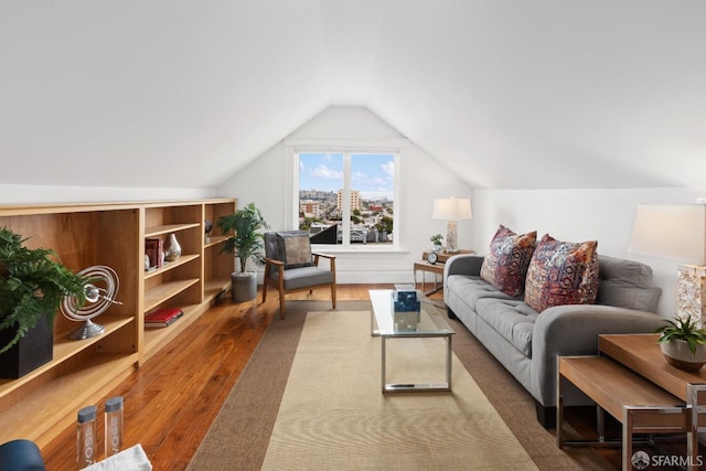 living room with hardwood / wood-style flooring and lofted ceiling