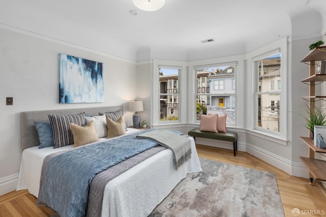 bedroom with hardwood / wood-style flooring