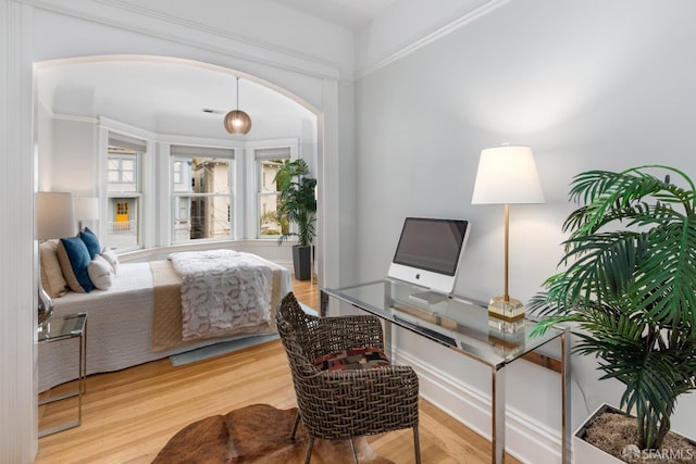 bedroom with hardwood / wood-style flooring