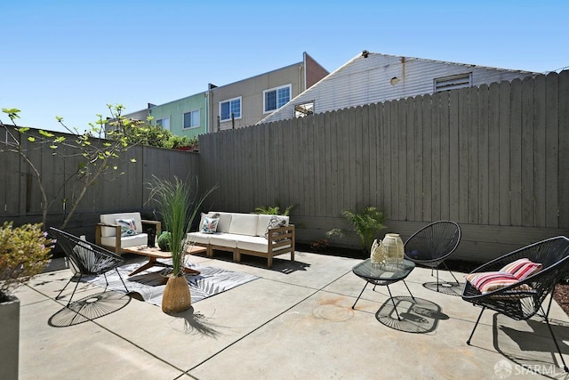 view of patio / terrace with fence and an outdoor living space