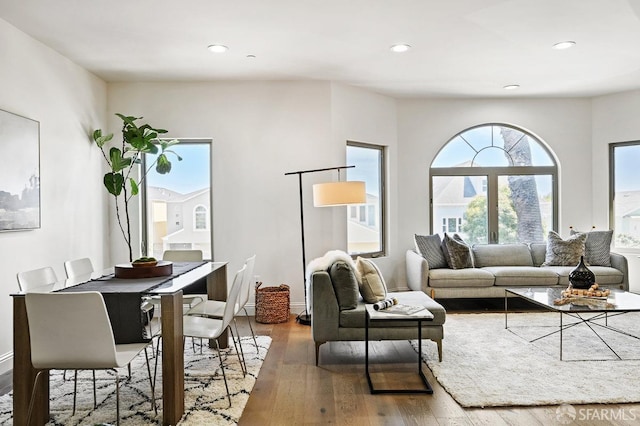 living room with hardwood / wood-style flooring, baseboards, and recessed lighting