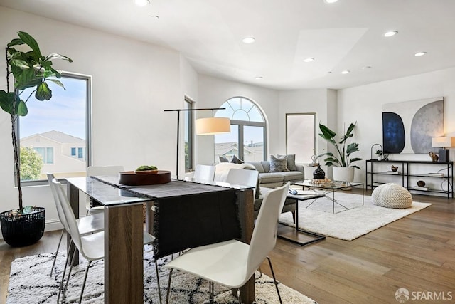 dining area with plenty of natural light, wood finished floors, and recessed lighting