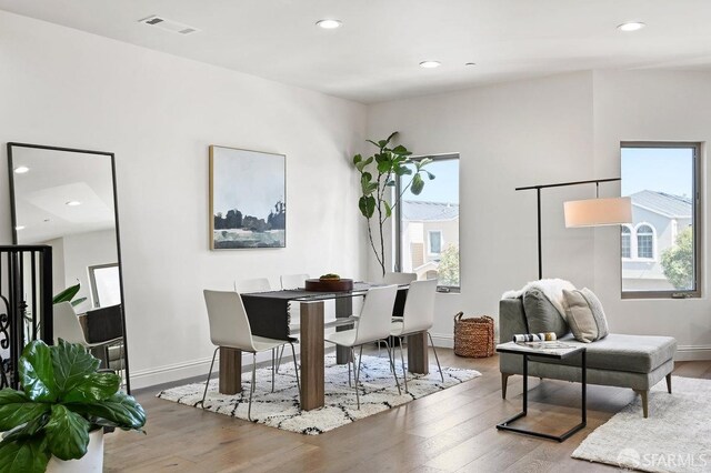 interior space featuring baseboards, wood finished floors, and recessed lighting