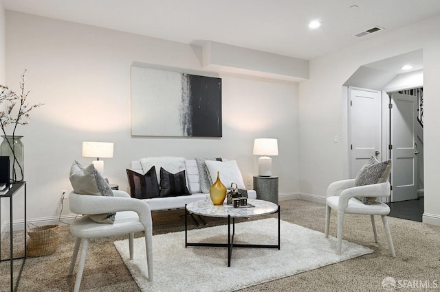 living room with recessed lighting, visible vents, and baseboards