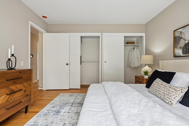 316 Gold Mine Dr, San Francisco, CA 94131 - bedroom featuring wood finished floors and multiple closets