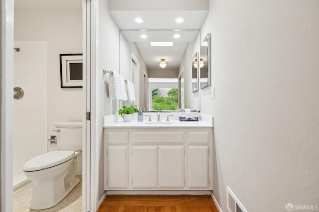 316 Gold Mine Dr, San Francisco, CA 94131 - bathroom featuring recessed lighting, tiled shower, toilet, vanity, and visible vents