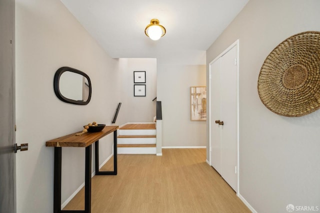 316 Gold Mine Dr, San Francisco, CA 94131 - hallway featuring baseboards, stairway, and light wood-style floors