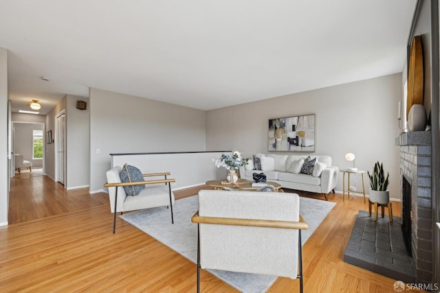 316 Gold Mine Dr, San Francisco, CA 94131 - living room featuring baseboards, a fireplace, and light wood finished floors