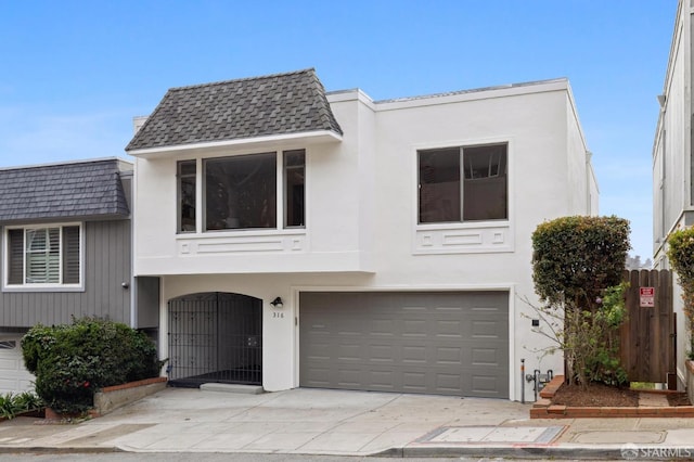 316 Gold Mine Dr, San Francisco, CA 94131 - view of front facade featuring driveway, a garage, stucco siding, and fence