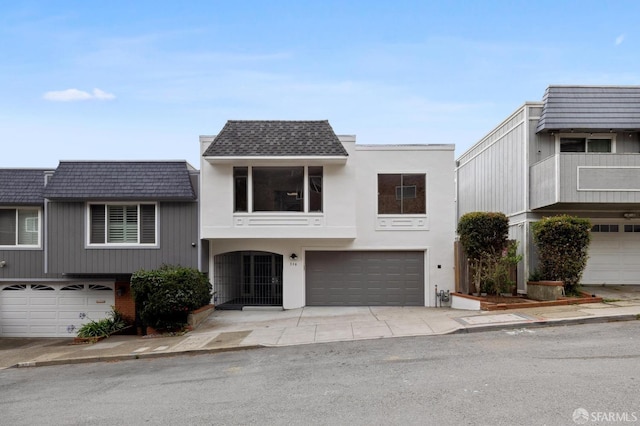 316 Gold Mine Dr, San Francisco, CA 94131 - view of front of home featuring concrete driveway, a garage, and mansard roof