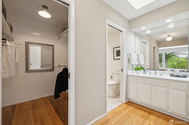 316 Gold Mine Dr, San Francisco, CA 94131 - bathroom with toilet, vanity, wood finished floors, and baseboards