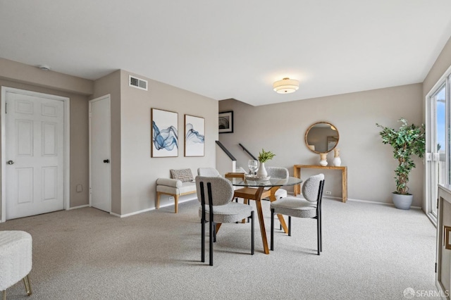 316 Gold Mine Dr, San Francisco, CA 94131 - dining room featuring baseboards, visible vents, and light colored carpet